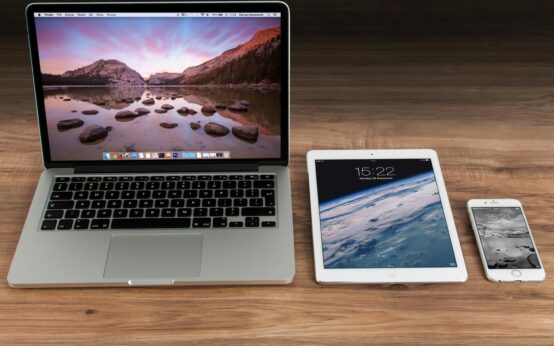 macbook pro beside white ipad
